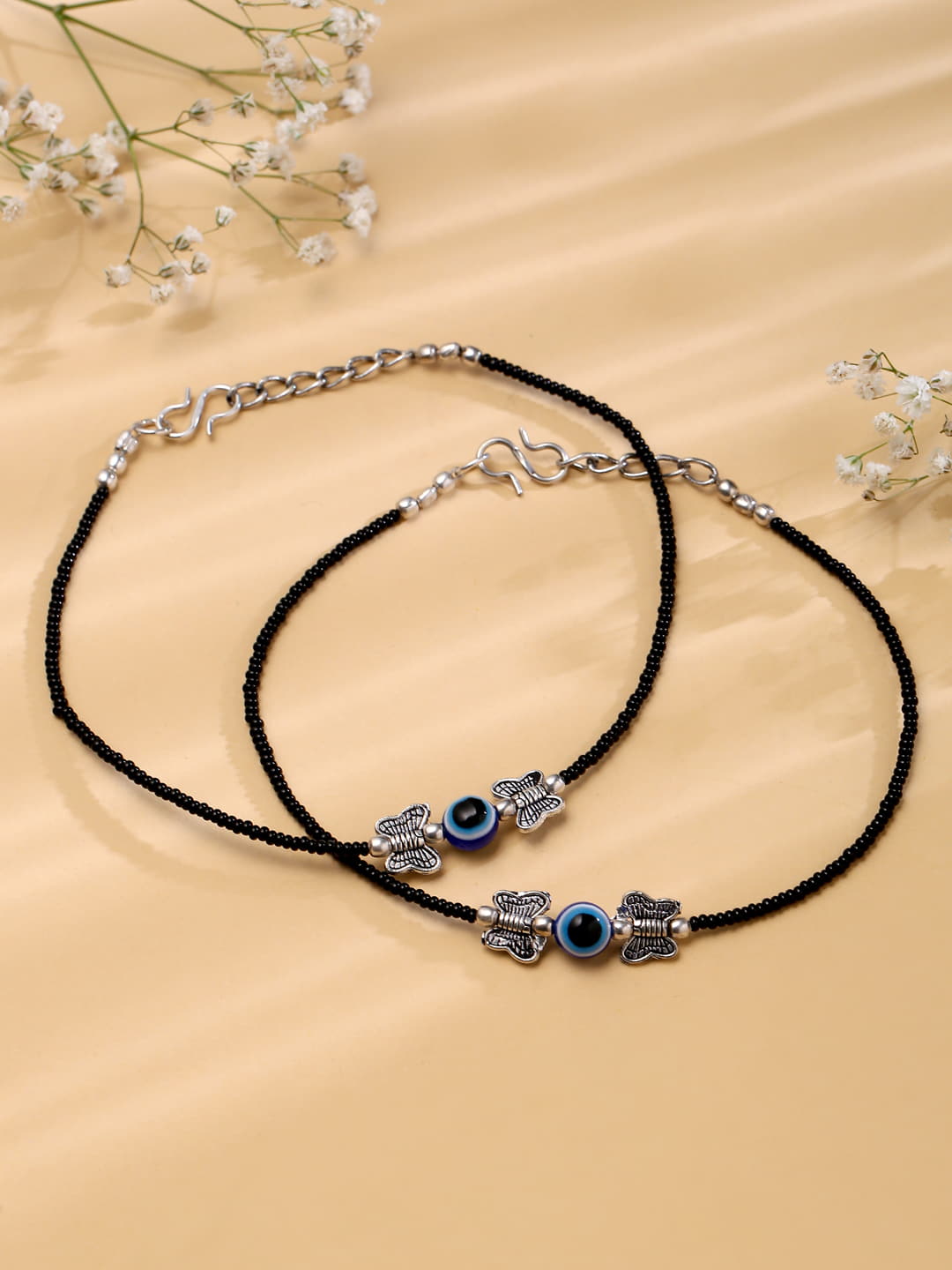black-beads-evil-eye-anklet-with-butterfly-shape-viraasi